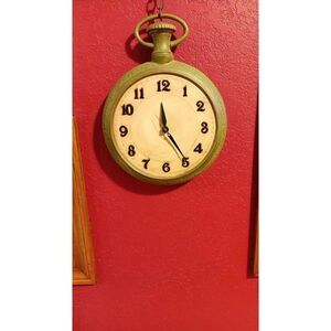 1974 Duncan ceramic products wall pocket watch with working clock. In good condi